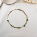 Gold Snake Chain Bracelet with Emerald Green Stone Accents